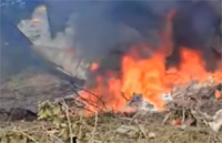 The crashed Colombian miiitary plane in flames